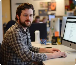 working at a computer in an office